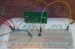 WB2S Module Flashing Setup on Breadboard Breadboard setup with connected PCB module, wires, and labeled UART lines and power supply.
