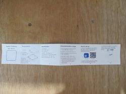 Zigbee Gateway user manual on a wooden surface.