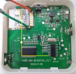 Interior of an electronic device showing circuit boards and electrical components.
