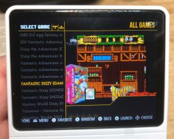Retro handheld console screen showing game list and preview of Fantastic Dizzy