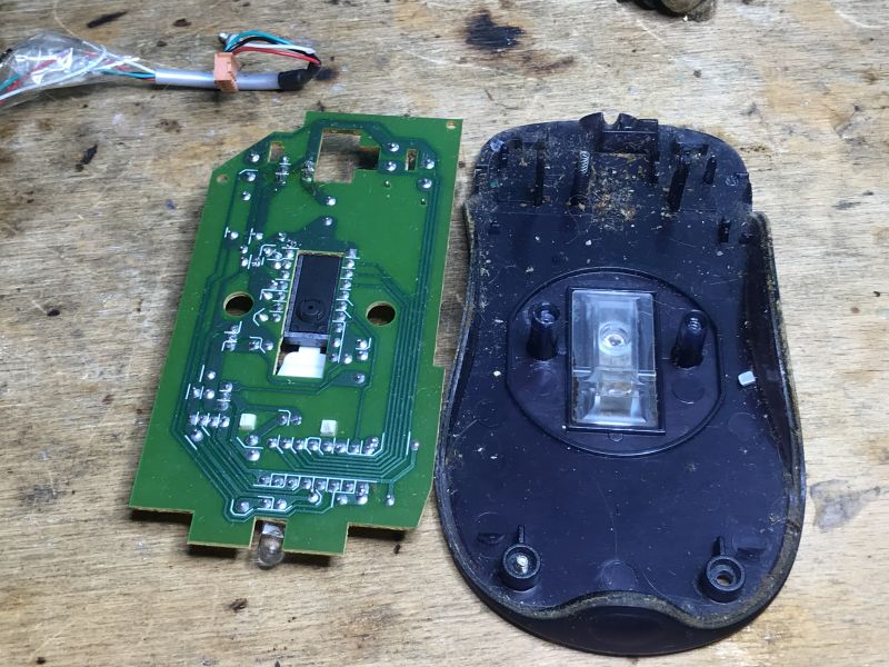 Interior of a Classic Computer Mouse Interior of a classic computer mouse with a circuit board and connector.