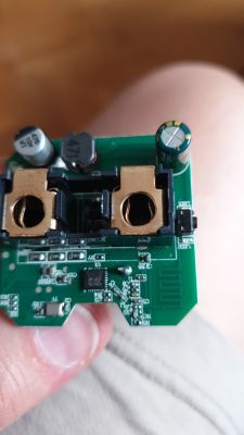 Close-up of a smart plug's mainboard with BK7231N chip and electronic components.