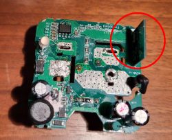PCB with electronic components and a vertical module on the right side