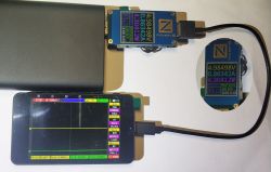 USB tester and oscilloscope measuring power bank charging parameters