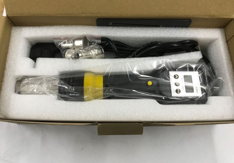 Open box with foam insert holding a 8898D handheld hot air tool and metal nozzles
