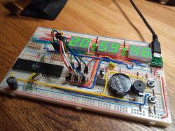 Vintage Clock Built on a Breadboard Breadboard with electronic components forming a 90s-style vintage clock.