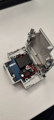 DIN Circuit Breaker with Display and Internal Components Open DIN circuit breaker with visible electronic components
