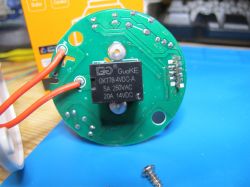 View of a circuit board with electronic components and markings.