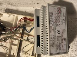 WRD-45i intercom amplifier with connected wires and labeled terminals