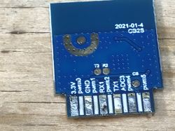 FL_M99_V1 Module with Pins FL_M99_V1 electronic module with visible pins on a white casing.
