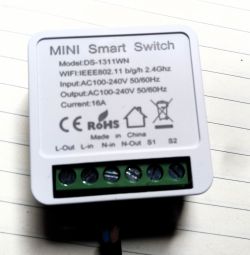 Image of a mini smart switch with technical information.