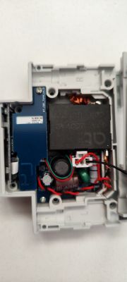 Interior of DIN Circuit Breaker with kWh Measurement Feature Interior of a disassembled DIN circuit breaker with electronic components.