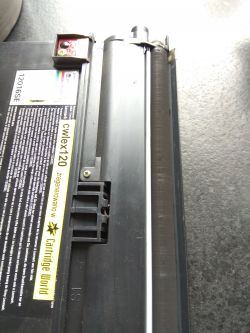 Lexmark E120 z białymi pasami na wydrukach - jaka część do wymiany?