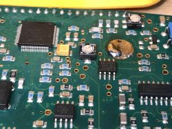 Close-up of a metal detector's PCB with various electronic components.