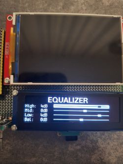 Two displays on a protoboard; the lower LCD shows “EQUALIZER” with sliders and dB values