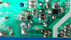 Close-up of a circuit board with various electronic components such as resistors and capacitors.