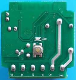 Bottom view of the AP-SMT-Breaker02-1CH PCB with a button and terminals.