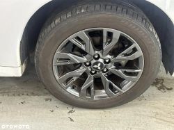 Mitsubishi car wheel with Bridgestone tire.