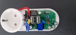Inside of a Smart Socket Image of the inside of a smart socket with visible PCB and electronic components.