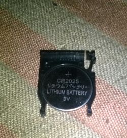 Bateria litowa CR2025 3V w plastikowym uchwycie na tkaninie