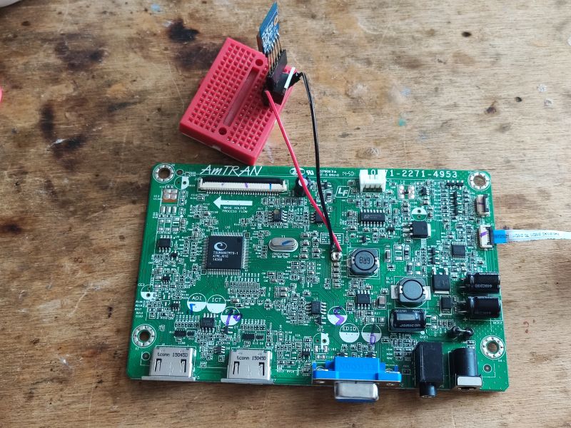PCB Board with WiFi Module PCB board with a WiFi module connected on a red breadboard.