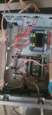 Interior view of a case with TPA3116 amplifier, wiring, and mounted electronic modules.