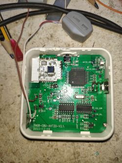 Close-up of the interior of an electronic device with connected wires.