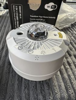 Star projector with transparent LED dome and control buttons on top