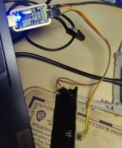 PCB Connection with USB Programmer Wires connected to a PCB and a USB programmer.