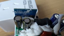 Interior of Arlec PC191HA Socket Close-up of the interior of an Arlec PC191HA socket showing capacitors and a silicone protective coating.