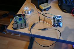 Flashing OpenBeken on Smart Plug Using Raspberry Pi Raspberry Pi connected with cables to a disassembled smart plug.