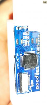 HC32F460 Chip on Blue PCB Circuit board with HC32F460 chip on a blue background.