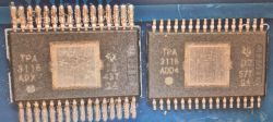 Two TPA3116 chips on PCB under magnification, showing different surface markings