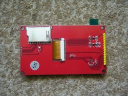 Red LCD module with SD card slot, FPC connector, and yellow pin header