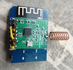 CC1101 Module with Antenna and ESP Board for wMBus 868 MHz Reception DIY setup for wireless signal reception: CC1101 module with coil antenna and ESP board connected by wires.