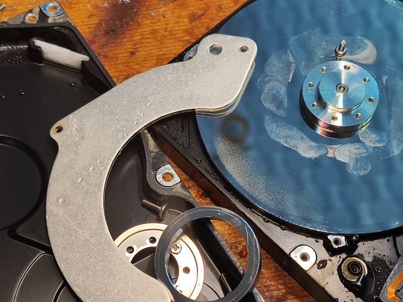 Hard Drive Interior with Fingerprints Image of a hard drive's interior with visible fingerprints on the platter.