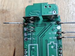 Printed circuit board with battery holders and visible soldered wire connections