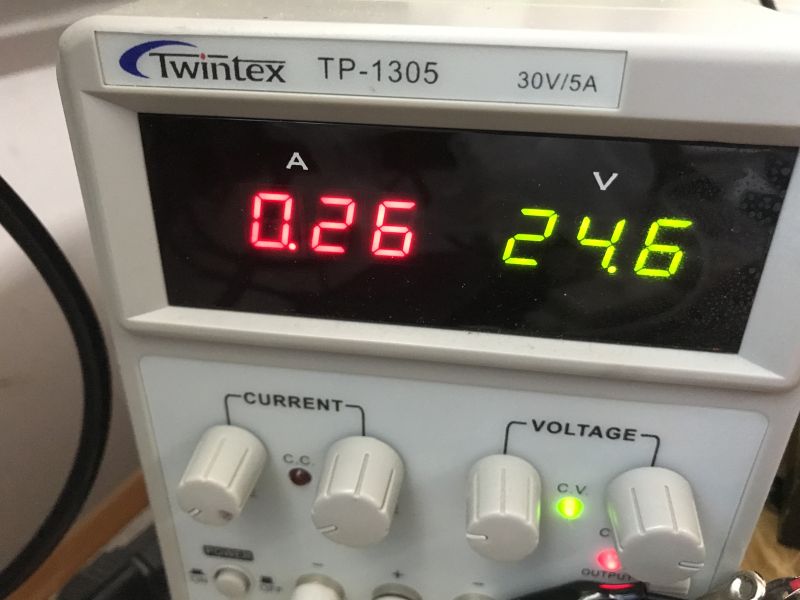 Close-up of a Twintex TP-1305 bench power supply showing 0.26 A and 24.6 V