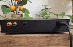 Back panel of DIY black radio case with audio and power connectors