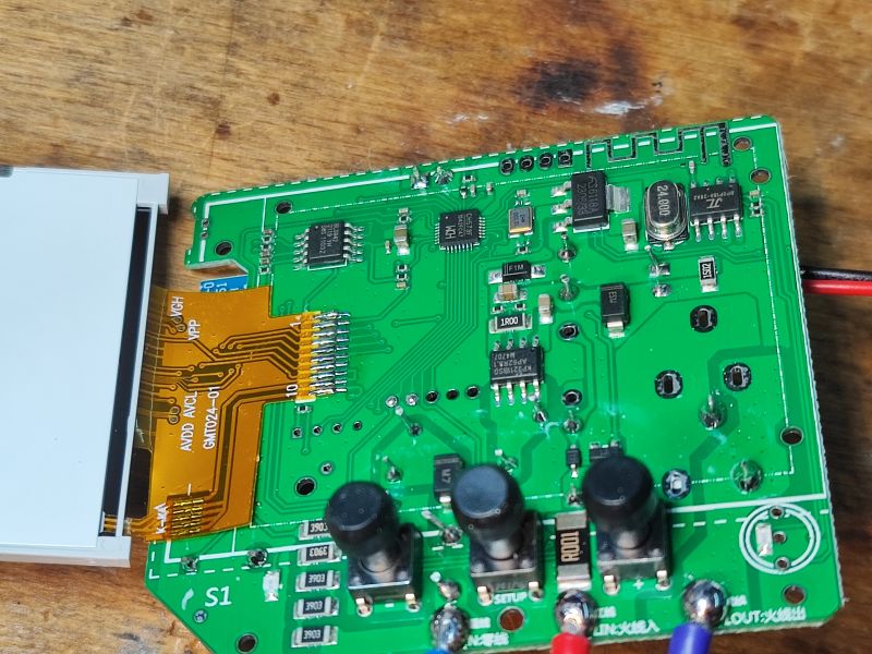 S1TW-FR Thermostat Circuit Board with Exposed Screen Photo of a circuit board of an energy meter/thermostat with exposed LCD section.