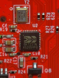 Close-up of BK7231N microcontroller on a red PCB.