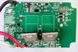 Inside View of Dimmer Circuit Board Internal circuit board with electronic components and wire connectors.