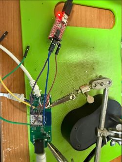 ESP module on PCB connected to USB-UART programmer with jumper wires
