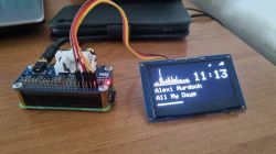 Compact Waveshare PCM5122 DAC on Raspberry Pi Zero2W with external OLED display showing music data.