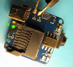 Circuit Board with Microchip from SQ11 Mini DV View of the disassembled circuit board with a microchip and marked TX point.
