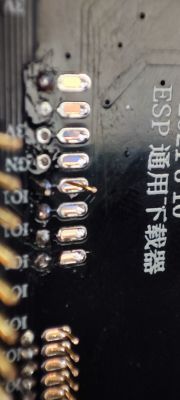 Close-up of an ESP-12F PCB with soldered contacts and flux residues.
