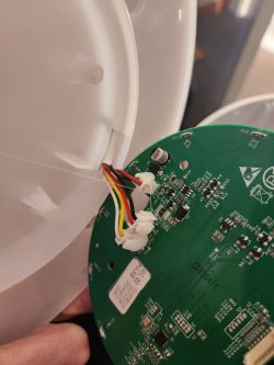 Inside of a Smart Device with PCB Inside a smart device showing a PCB and connected wires.
