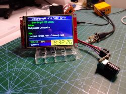 MP3 player prototype with a color display on a cutting mat, plus a rotary encoder and wires.