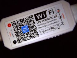 WiFi LED controller with a QR code and specifications on the casing.