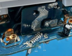 Close-up of electronic components on a circuit board with labeled GND and 3.3V points.